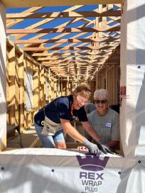 Jeanne and Phyllis, lining the window frames