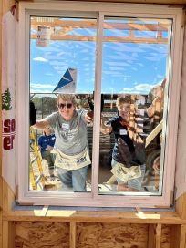 Melanie and Jeanne, installing the first window