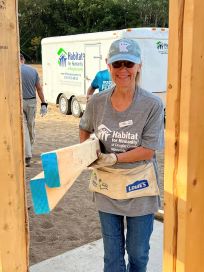 Thea hauling lumber with a smile